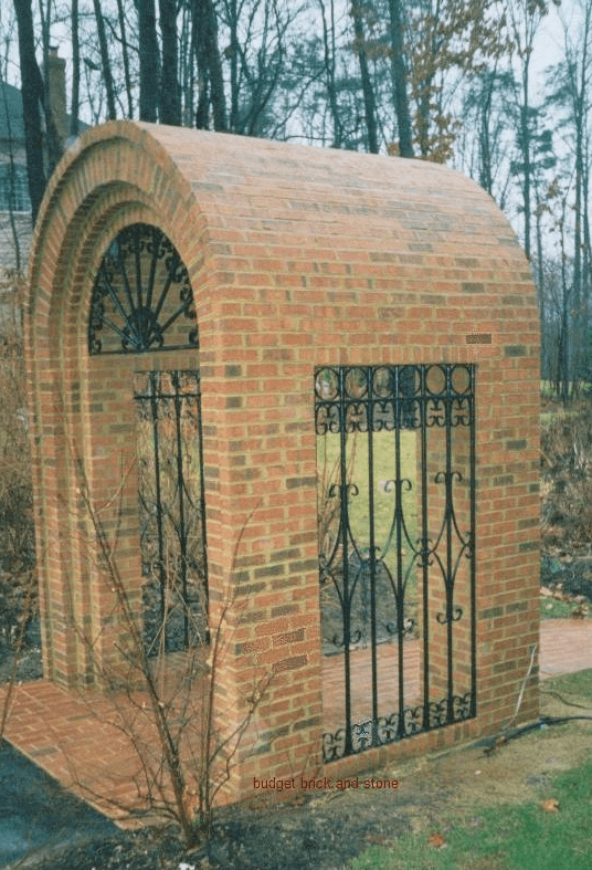 Fancy brick arch, steel scroll and walkway.