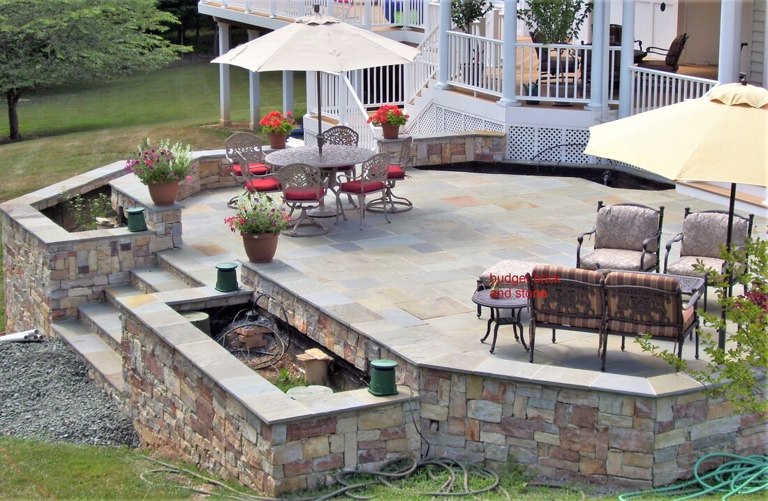 Flagstone and pennsboro stone patio, walls and steps.