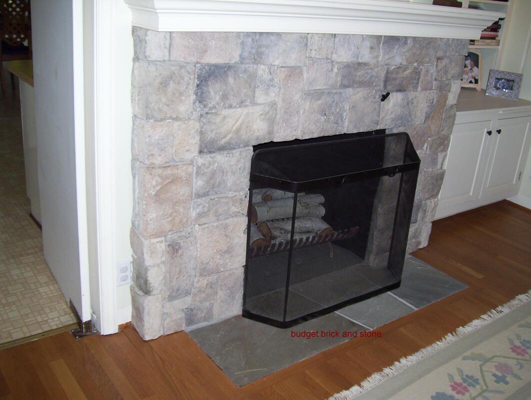 Culture stone fireplace and flagstone hearth.